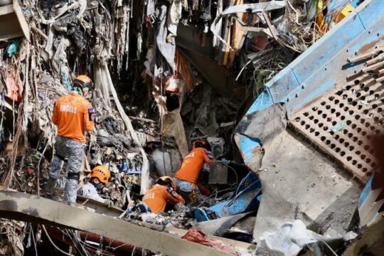 Rescuers Detect Signs of Life After Garbage Avalanche