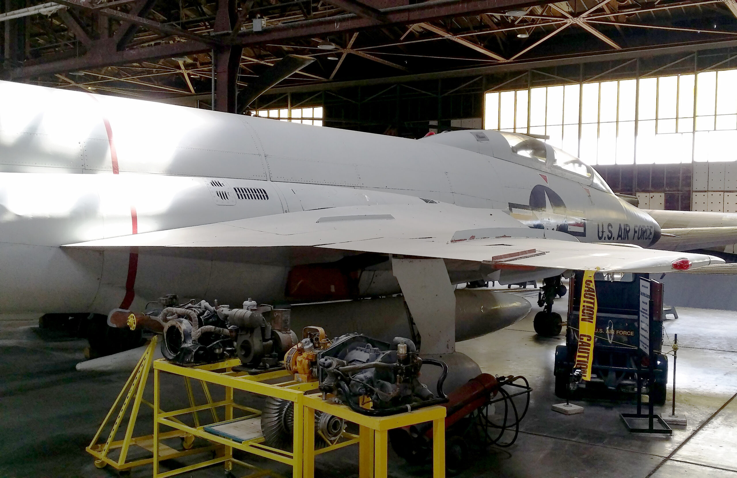 A grounded commercial jet surrounded by maintenance crews in Havana
