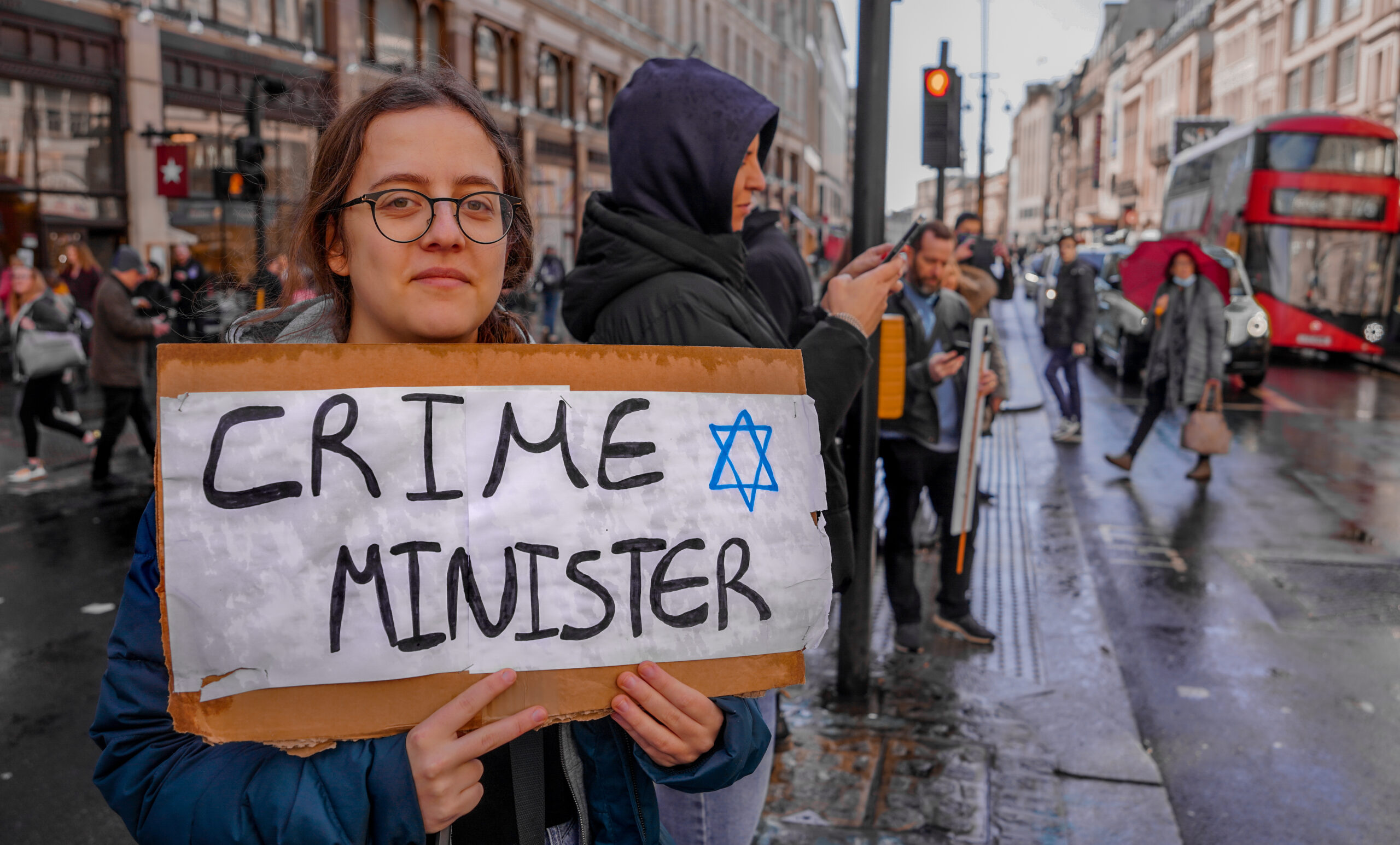 Protest signs and demonstrators advocating civil rights, emphasizing peaceful dissent