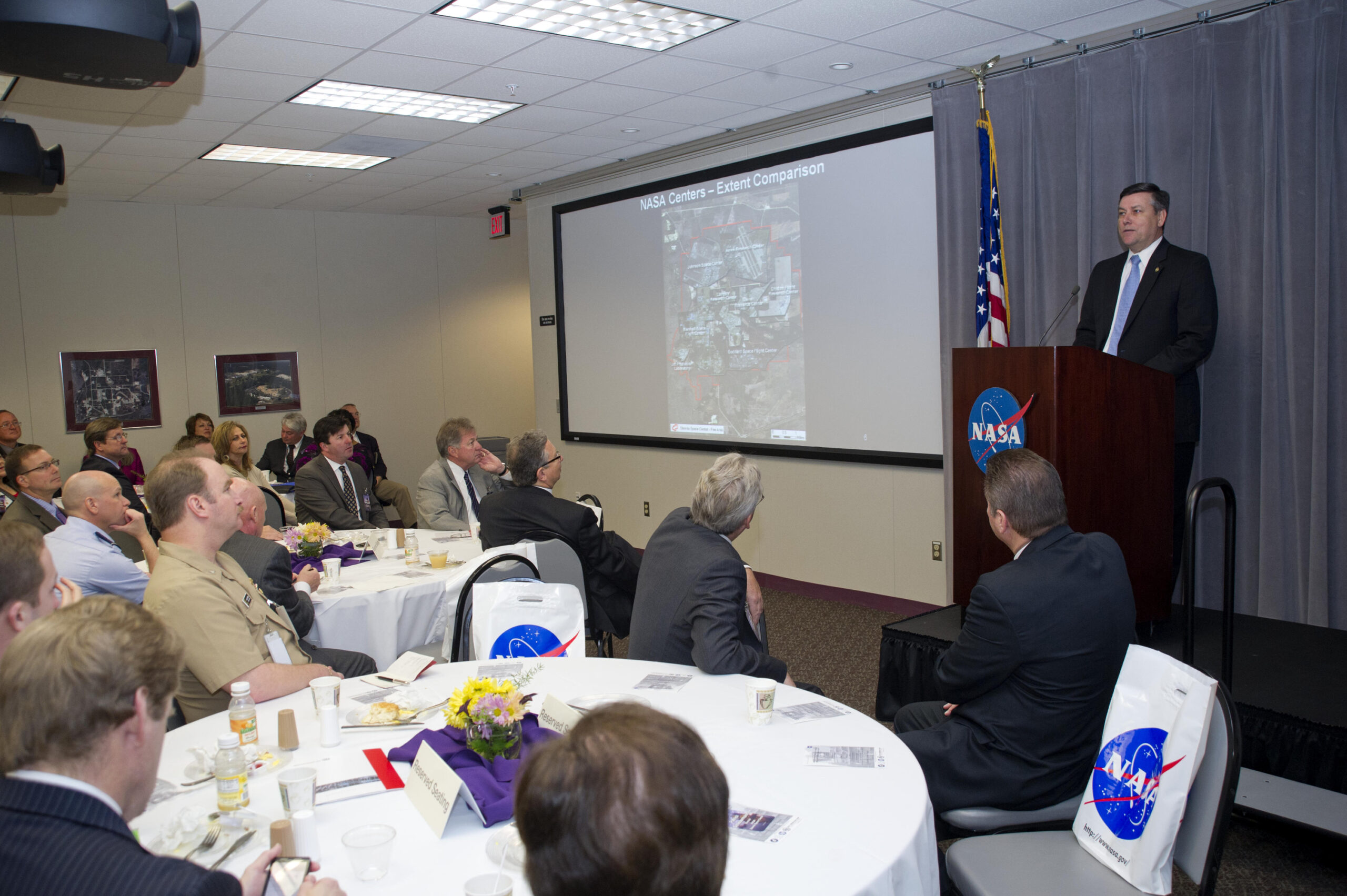 A vibrant community event in a library with diverse attendees