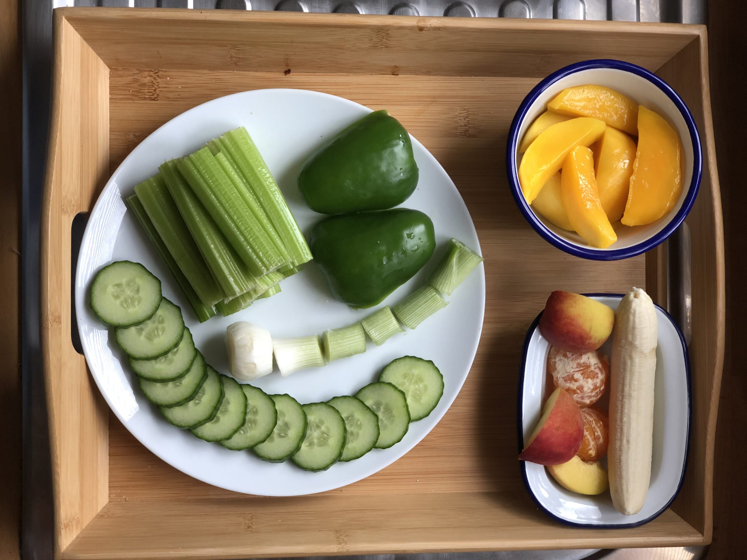A colorful plate of vegetables on a modern kitchen table