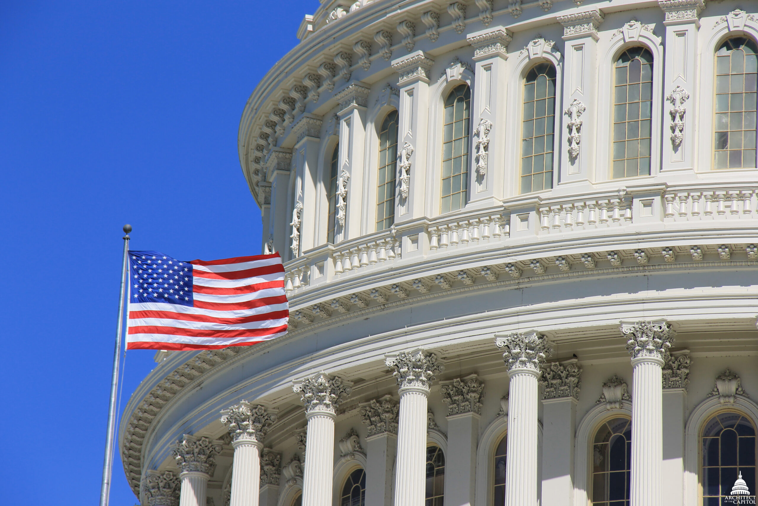 US Capitol building prominently displaying the American flag