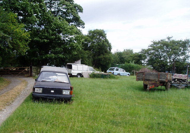 An abandoned van in a rural setting, symbolizing isolation