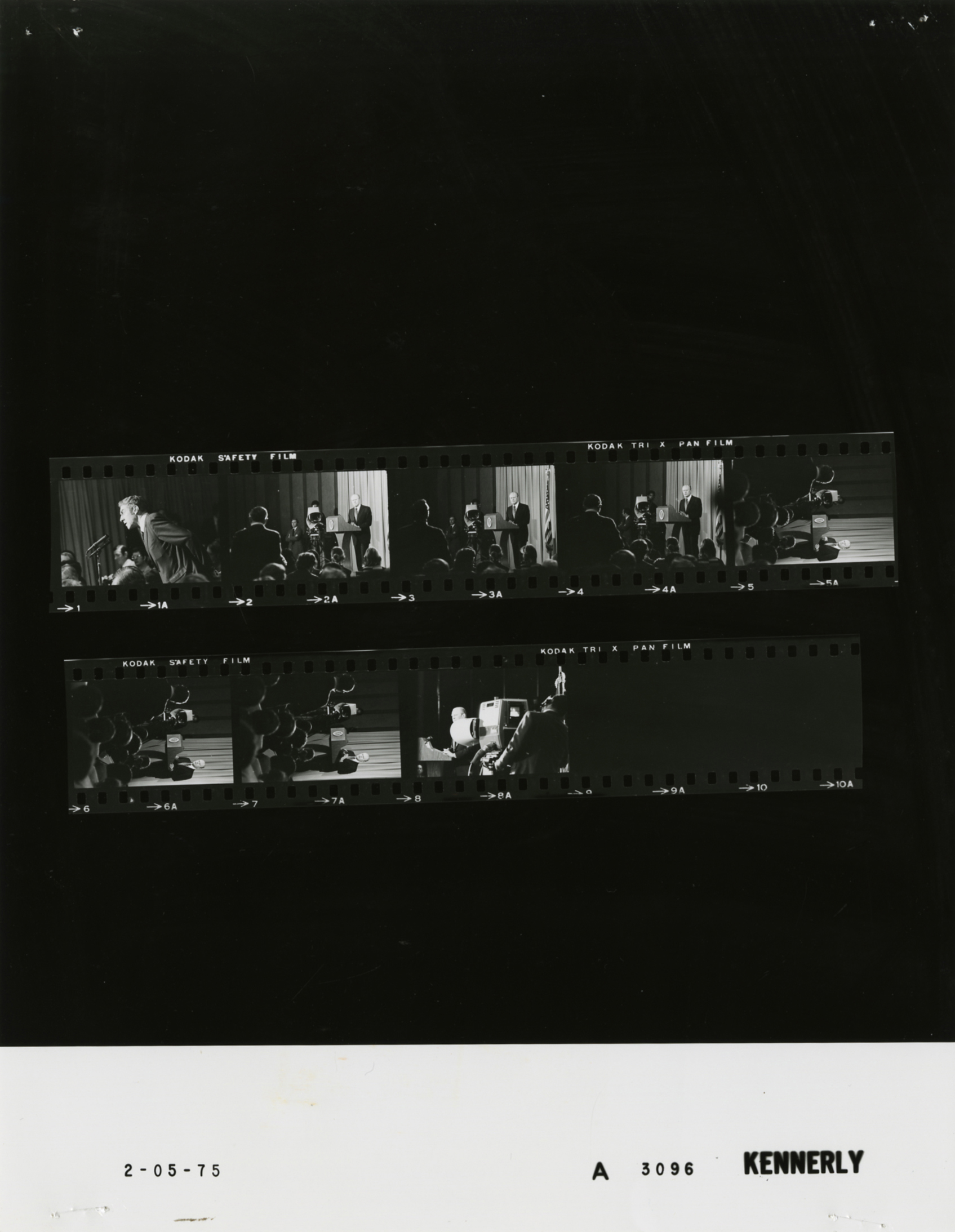 A crowded White House press room filled with journalists, cameras, and microphones covering a major event