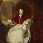 Portrait of a man in a red ceremonial robe and white garments, seated on a wooden throne before red drapery.